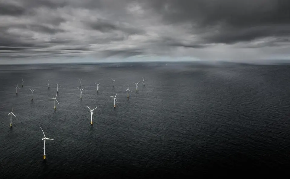 Offshore wind turbines in stormy ocean